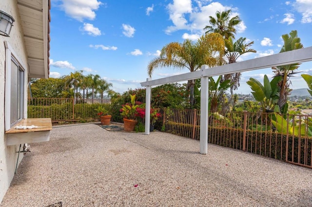 view of patio / terrace featuring fence