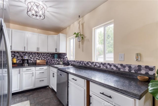 12022 W Redbank St, Sun Valley, CA 91352 - kitchen featuring stainless steel appliances, a sink, and dark countertops