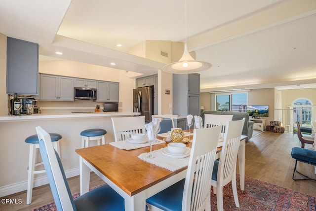 1130 Mandalay Beach Rd, Oxnard, CA 93035 - dining room featuring light wood-style floors, lofted ceiling, recessed lighting, and visible vents