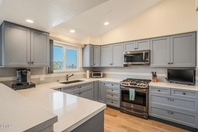 1130 Mandalay Beach Rd, Oxnard, CA 93035 - kitchen featuring stainless steel appliances, a sink, and gray cabinets