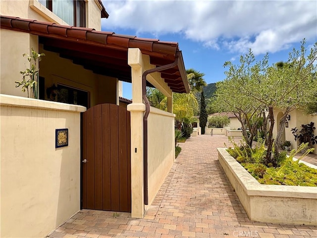 344 Triana Ln Unit 102, Avalon, CA 90704 - view of side of property with a gate and stucco siding