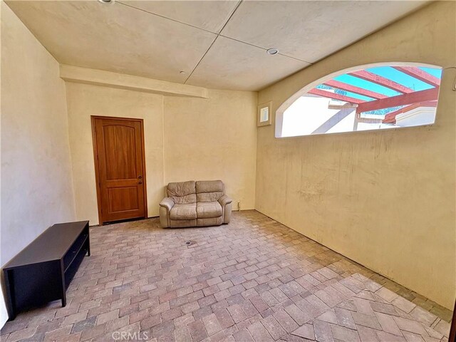 344 Triana Ln Unit 102, Avalon, CA 90704 - living area featuring brick floors