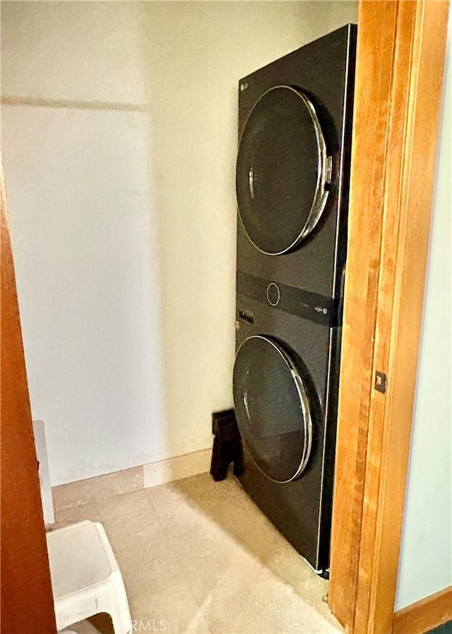 344 Triana Ln Unit 102, Avalon, CA 90704 - washroom featuring stacked washing machine and dryer and baseboards