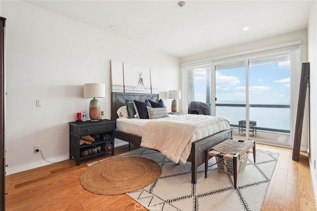 575 Esplanade Unit 205, Redondo Beach, CA 90277 - bedroom with access to outside, light wood-style flooring, a water view, and recessed lighting