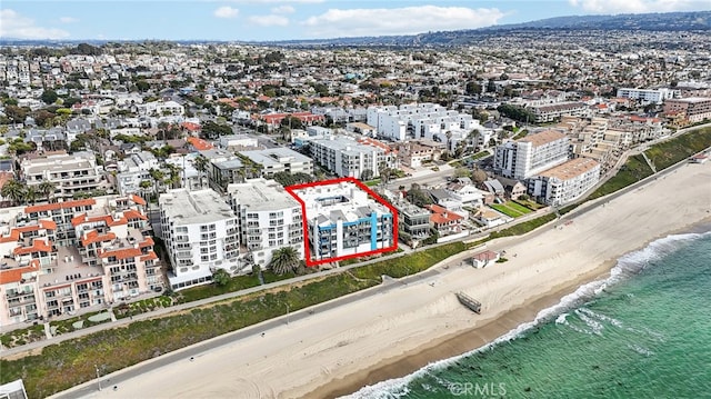 aerial view featuring a water view and a beach view