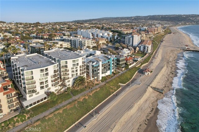 bird's eye view with a water view and a view of the beach
