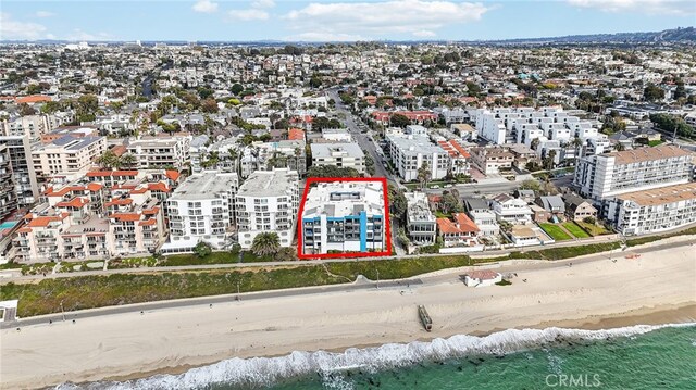 bird's eye view featuring a beach view and a water view