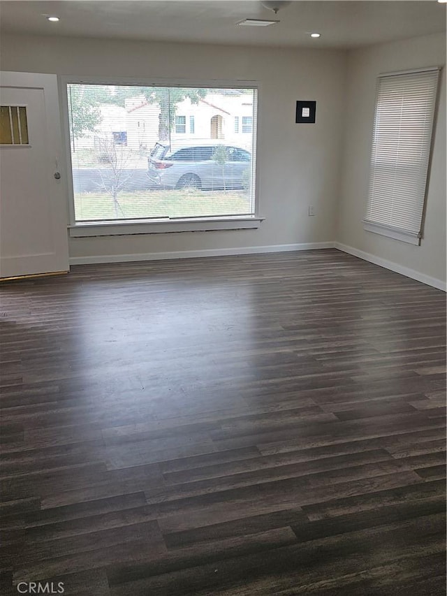 44645 Fig Ave, Lancaster, CA 93534 - unfurnished room with baseboards, recessed lighting, and dark wood-style floors