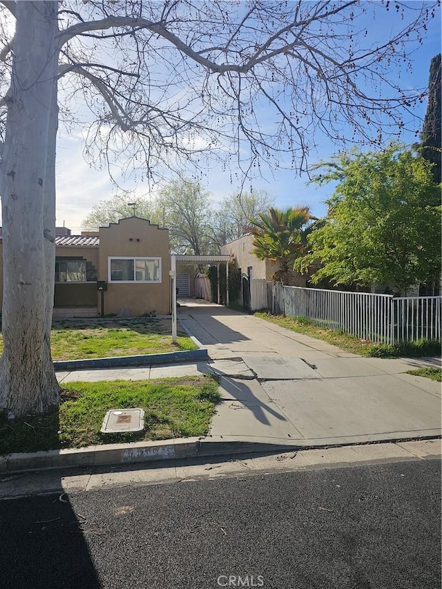 44645 Fig Ave, Lancaster, CA 93534 - view of front of property with concrete driveway, fence, and stucco siding