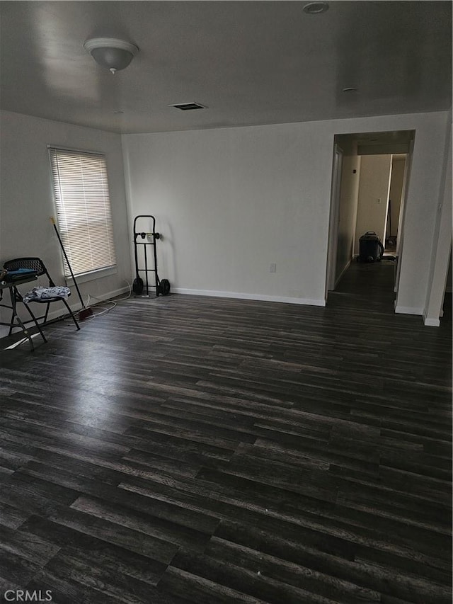 44645 Fig Ave, Lancaster, CA 93534 - empty room featuring dark wood-type flooring, baseboards, and visible vents