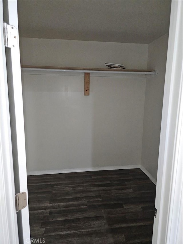 44645 Fig Ave, Lancaster, CA 93534 - walk in closet with dark wood-type flooring
