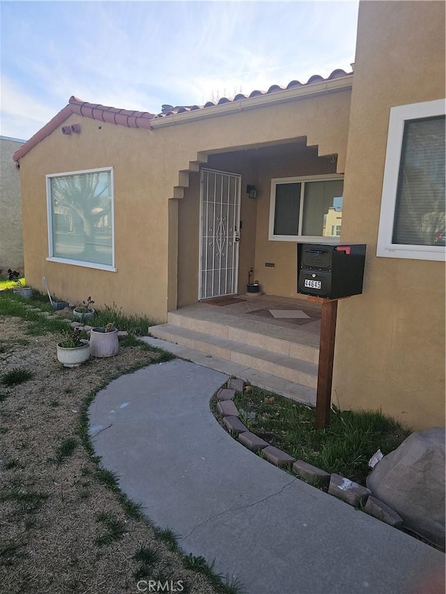 44645 Fig Ave, Lancaster, CA 93534 - doorway to property with stucco siding