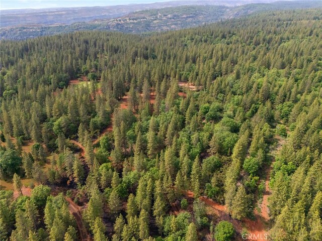 aerial view with a view of trees and a mountain view