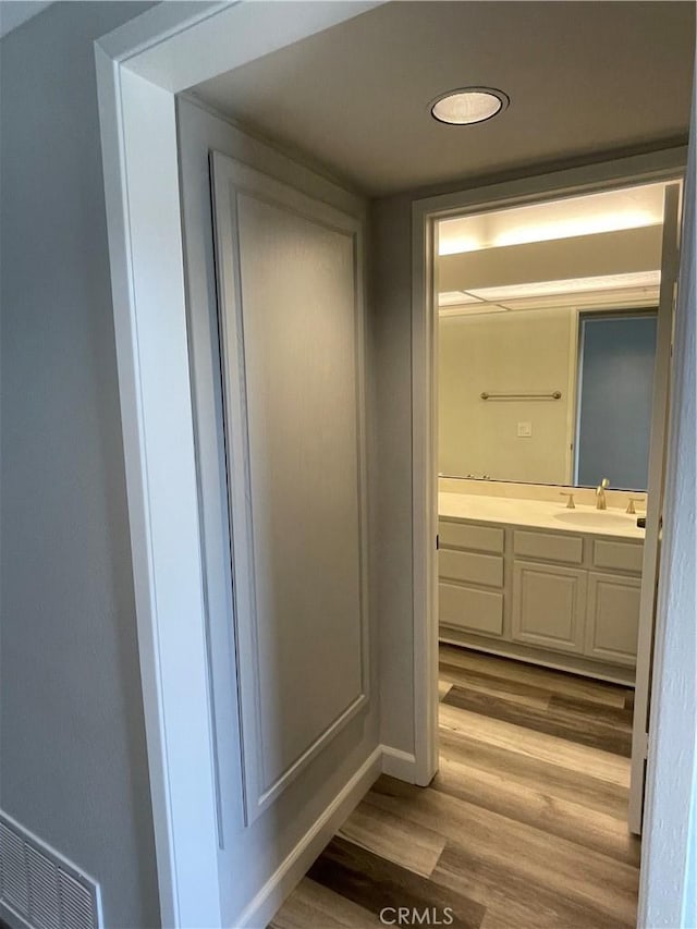 33741 Edgewater Dr Unit 164, Dana Point, CA 92629 - bathroom with wood finished floors, vanity, and baseboards