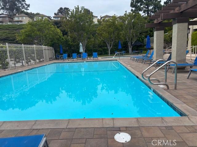 33741 Edgewater Dr Unit 164, Dana Point, CA 92629 - community pool featuring a patio area, a pergola, and fence