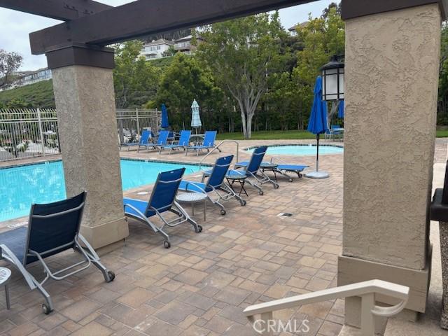 33741 Edgewater Dr Unit 164, Dana Point, CA 92629 - community pool featuring fence and a patio