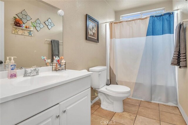 1925 Glenoaks Blvd, Unit San Fernando, CA 91340 - full bathroom with tile patterned flooring, toilet, vanity, and shower / tub combo with curtain