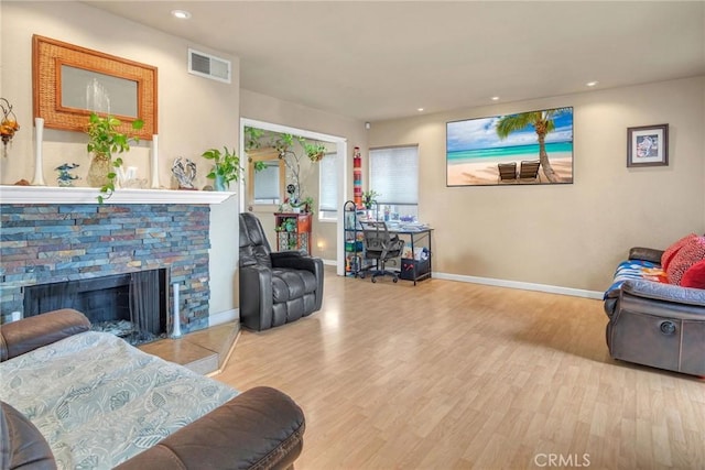 1925 Glenoaks Blvd, Unit San Fernando, CA 91340 - living room featuring wood finished floors, baseboards, recessed lighting, and a fireplace