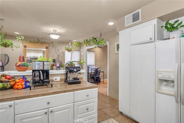 1925 Glenoaks Blvd, Unit San Fernando, CA 91340 - kitchen featuring white cabinetry, white refrigerator with ice dispenser, tile countertops, light tile patterned floors, and recessed lighting