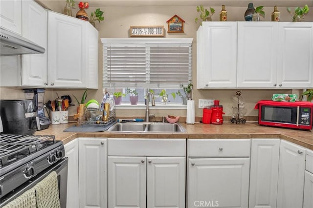 1925 Glenoaks Blvd, Unit San Fernando, CA 91340 - kitchen featuring a sink, black range with gas cooktop, white cabinets, and light countertops
