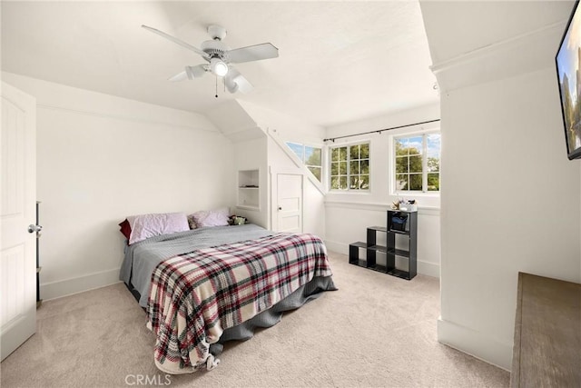 carpeted bedroom with baseboards and ceiling fan
