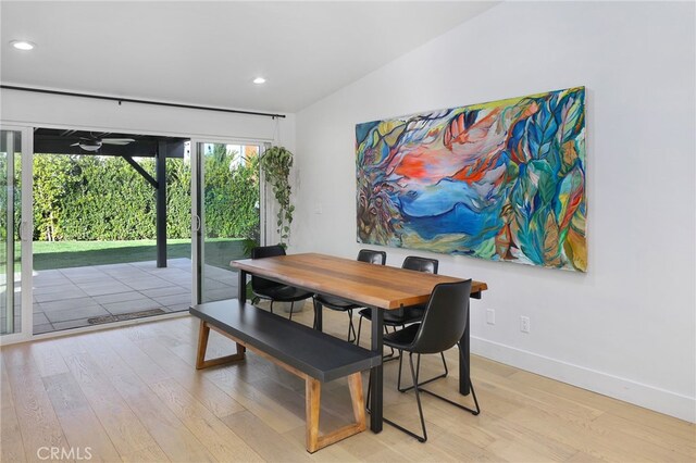 dining space featuring recessed lighting, baseboards, and light wood-type flooring