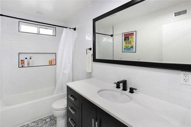 bathroom with decorative backsplash, shower / bath combination with curtain, visible vents, vanity, and toilet