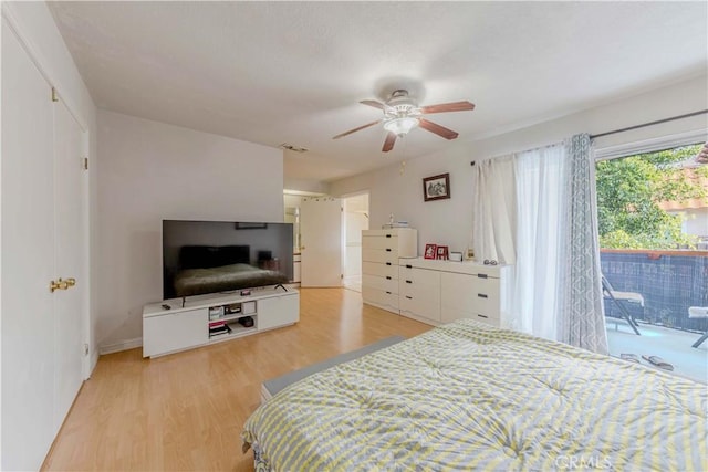 bedroom with a ceiling fan, light wood-style floors, and access to outside