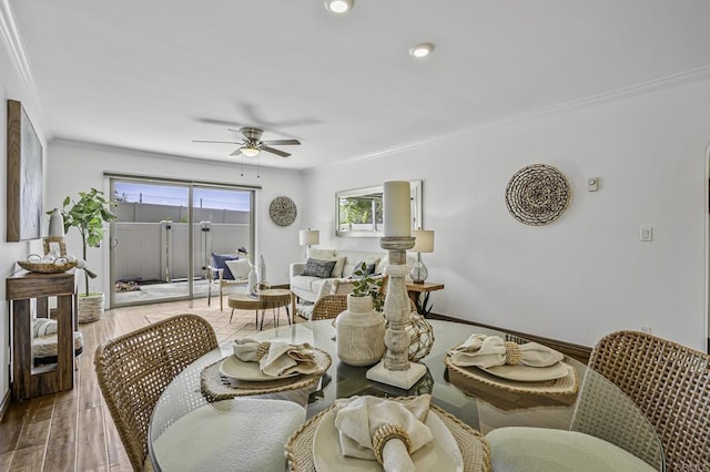 dining space with a ceiling fan, wood finished floors, baseboards, ornamental molding, and recessed lighting