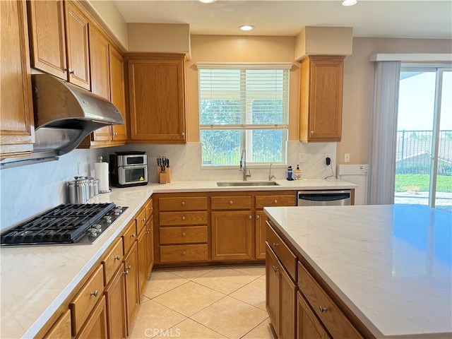 12271 Oldenberg Ct, Rancho Cucamonga, CA 91739 - kitchen with a sink, stainless steel appliances, tasteful backsplash, brown cabinets, and light tile patterned floors