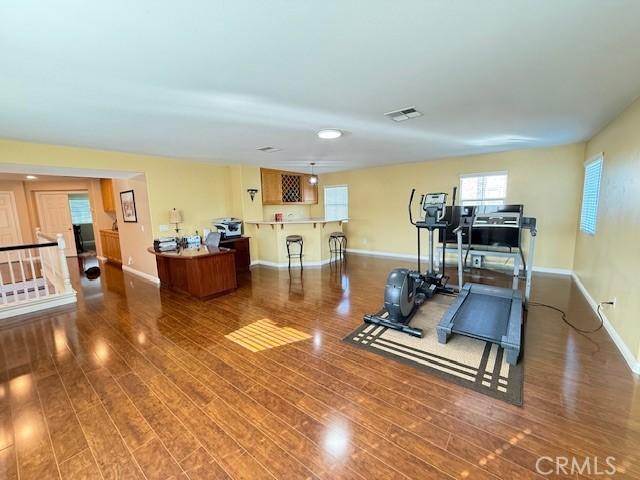 12271 Oldenberg Ct, Rancho Cucamonga, CA 91739 - workout room featuring wood finished floors and baseboards