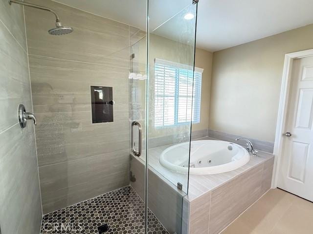 12271 Oldenberg Ct, Rancho Cucamonga, CA 91739 - full bath featuring a shower stall, a whirlpool tub, and tile patterned floors