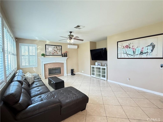12271 Oldenberg Ct, Rancho Cucamonga, CA 91739 - living area with light tile patterned floors, ceiling fan, baseboards, a glass covered fireplace, and an AC wall unit