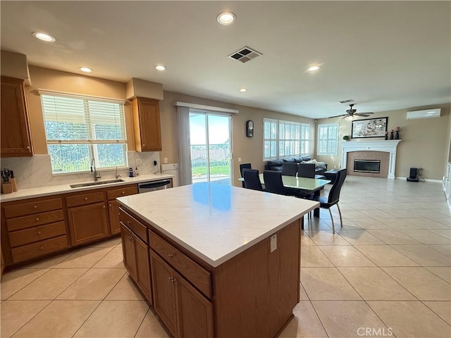 12271 Oldenberg Ct, Rancho Cucamonga, CA 91739 - kitchen with a sink, a glass covered fireplace, a ceiling fan, light tile patterned floors, and recessed lighting