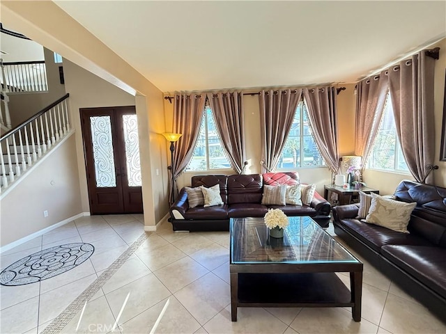 12271 Oldenberg Ct, Rancho Cucamonga, CA 91739 - living area with healthy amount of natural light, baseboards, light tile patterned floors, and stairs