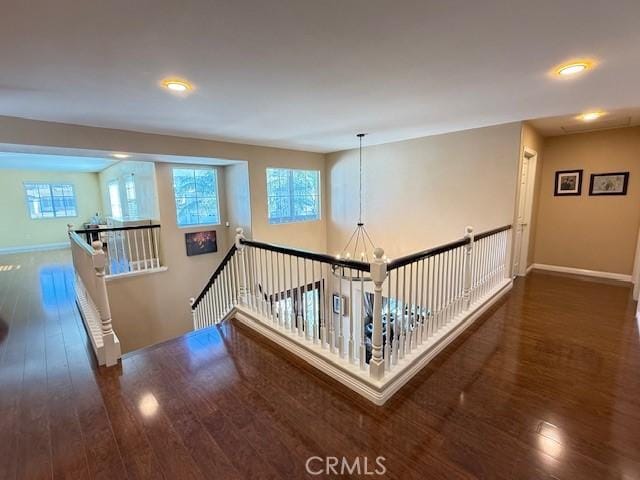 12271 Oldenberg Ct, Rancho Cucamonga, CA 91739 - corridor with an upstairs landing, wood-type flooring, plenty of natural light, and recessed lighting
