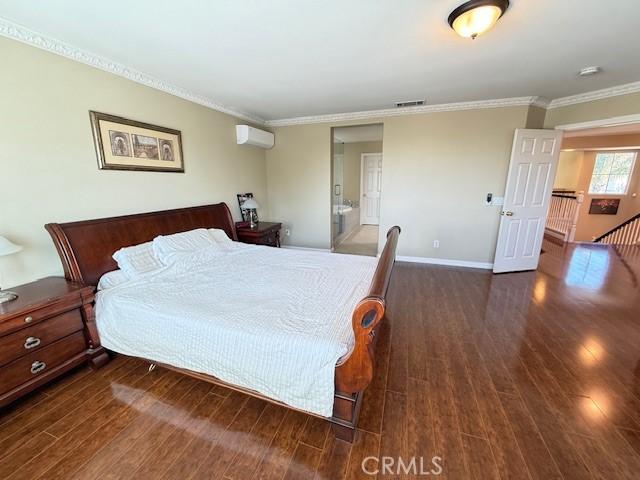 12271 Oldenberg Ct, Rancho Cucamonga, CA 91739 - bedroom with a wall mounted AC, dark wood-style floors, crown molding, and baseboards