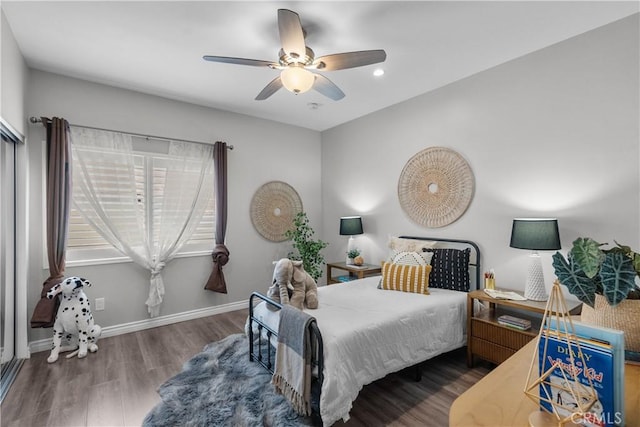 bedroom featuring baseboards, a ceiling fan, recessed lighting, and wood finished floors