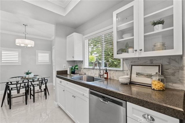 kitchen featuring dark countertops, a sink, dishwasher, marble finish floor, and glass insert cabinets