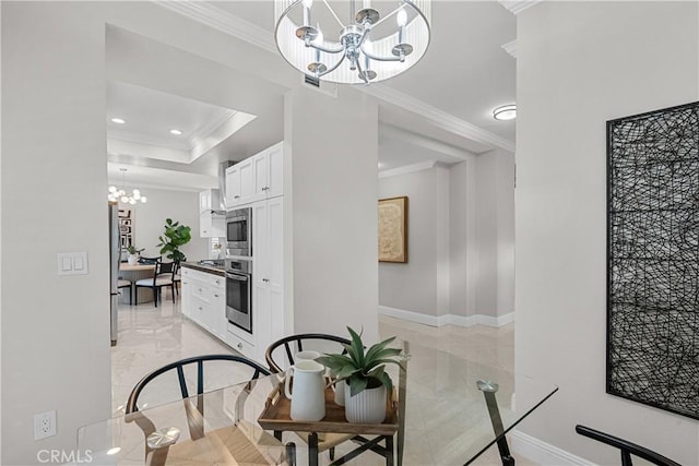 dining space with recessed lighting, baseboards, an inviting chandelier, and ornamental molding