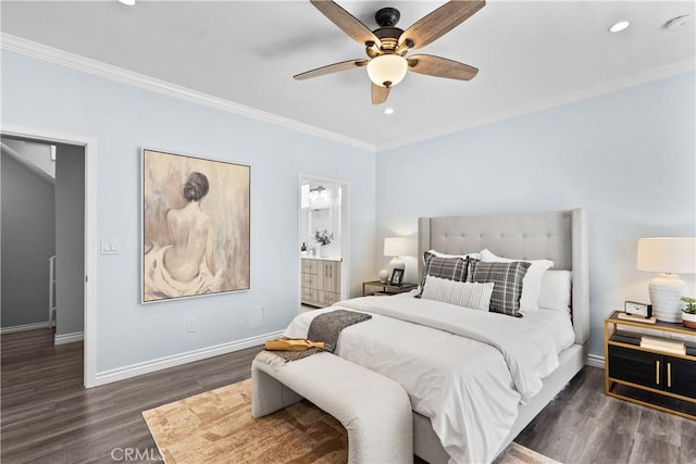 bedroom featuring crown molding, baseboards, and wood finished floors
