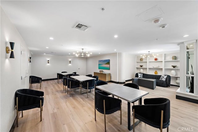 dining area featuring an inviting chandelier, light wood-style flooring, recessed lighting, baseboards, and visible vents