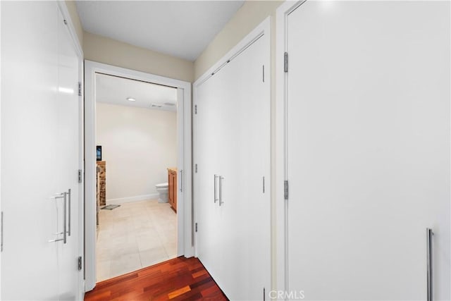 corridor with wood finished floors