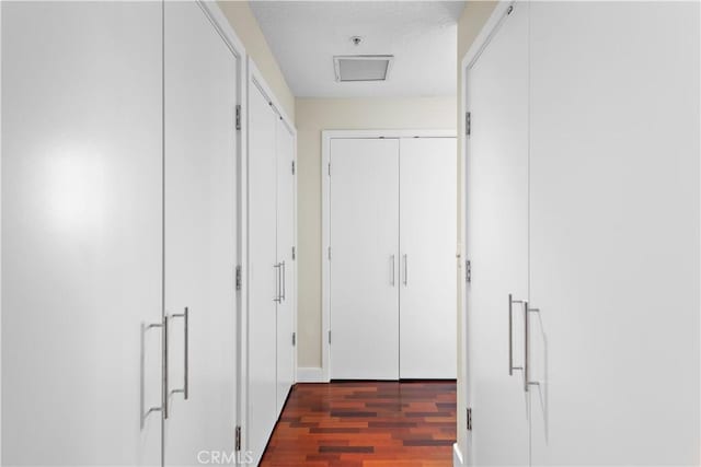 hallway with dark wood finished floors