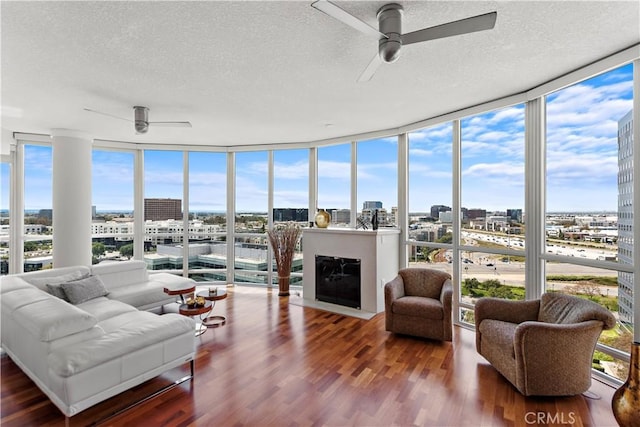 sunroom with a view of city and a wealth of natural light