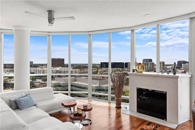 sunroom with a view of city and plenty of natural light