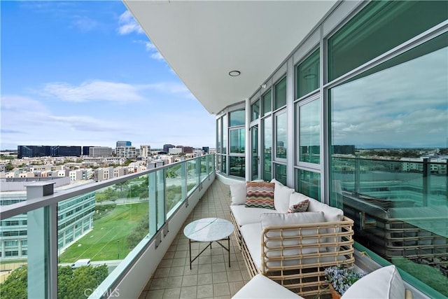 balcony with a view of city and an outdoor living space