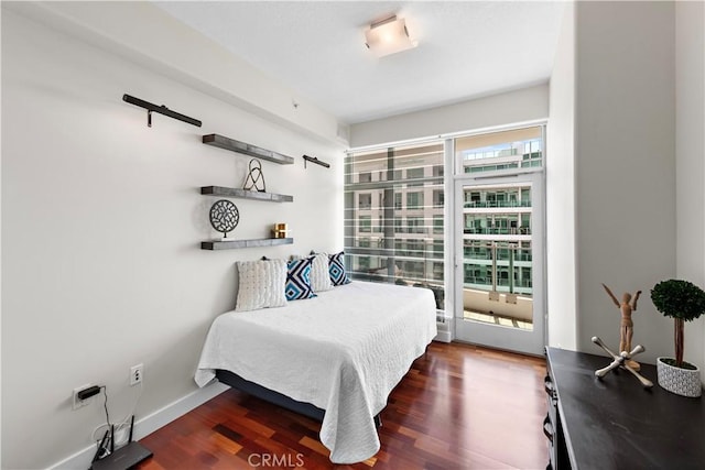 bedroom with wood finished floors
