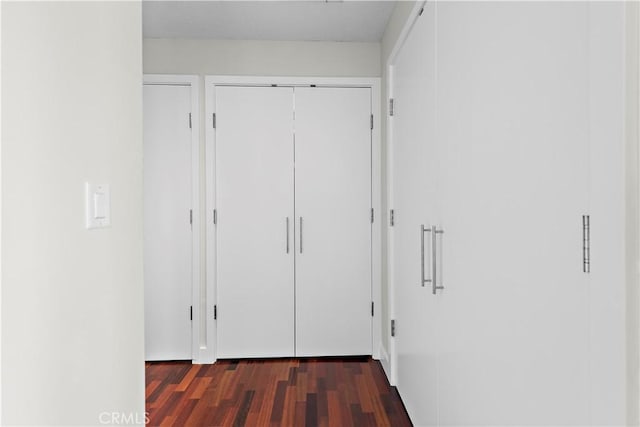 corridor featuring wood finished floors