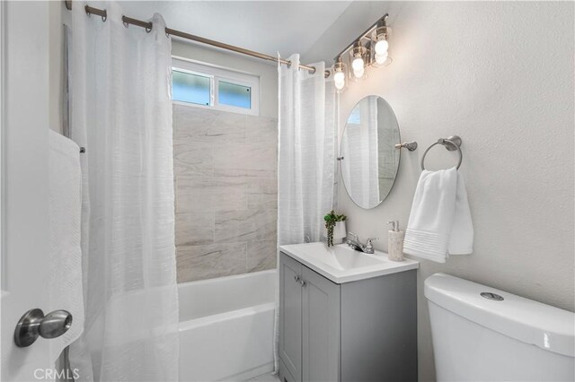 full bathroom with toilet, shower / bathtub combination with curtain, and vanity